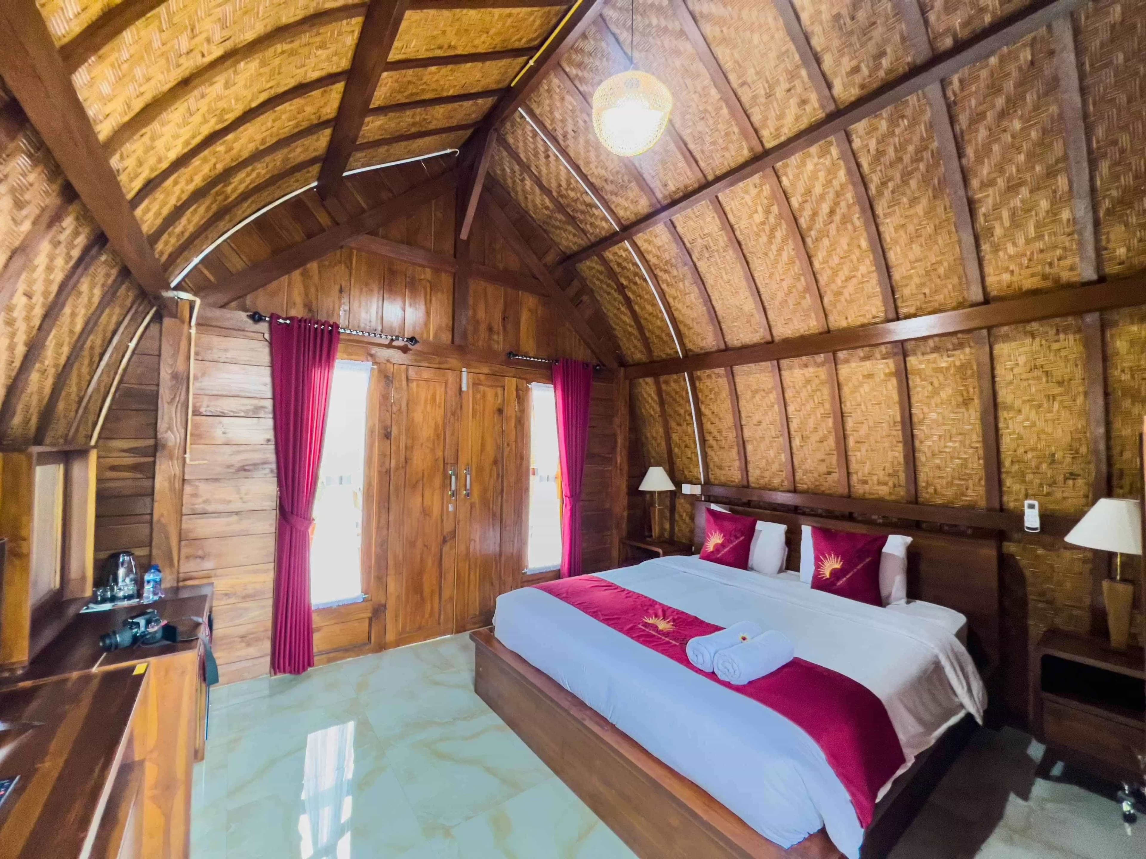 Luxury Joglo room interior with bamboo ceiling and double bed